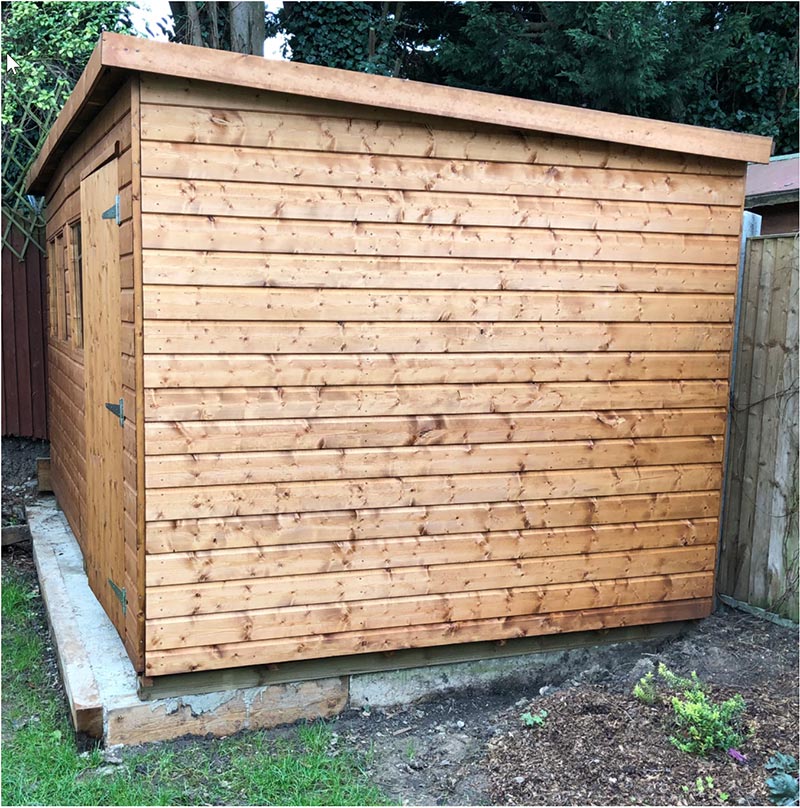 side on view of a large wooden shed
