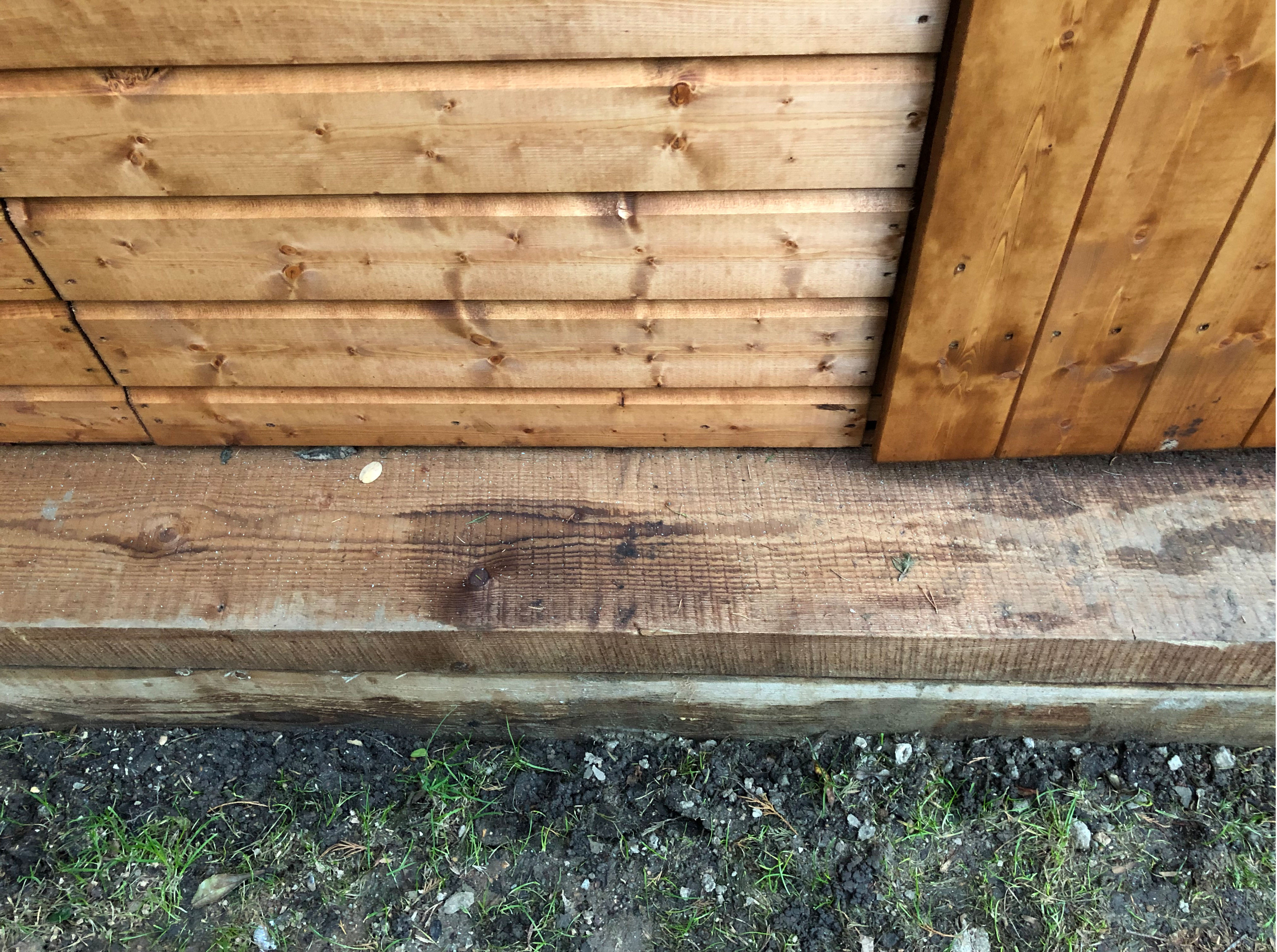 lower front section of a wooden shed