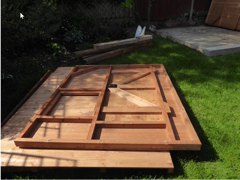 unassembled front panel of a wooden shed