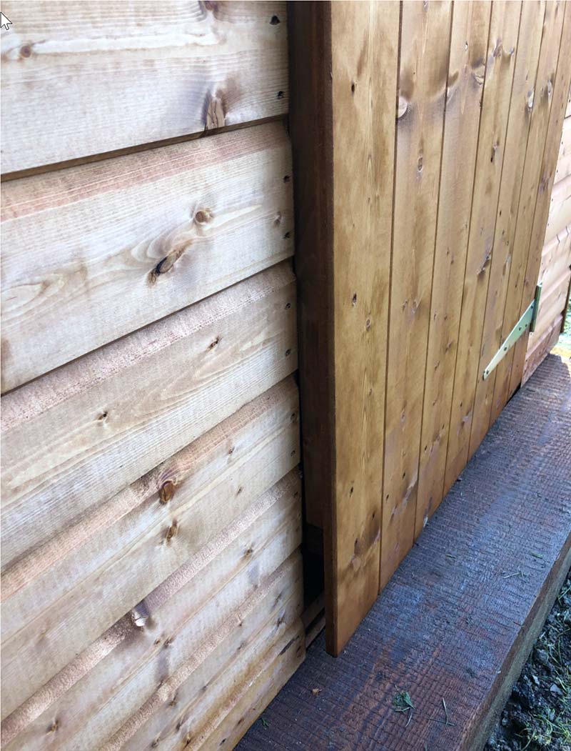 door of a wooden shed ajar